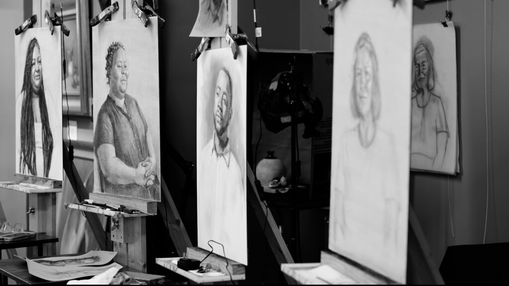 Drawings from Faces Beyond Homelessness in artist studio