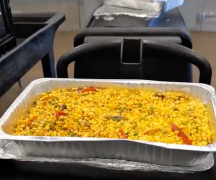A catering tray of hot food