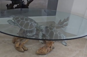 Glass table featuring sea turtles, artwork by Robert Wyland